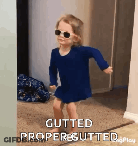 A Little Girl Wearing Sunglasses Is Dancing And Says Gutted Propergutted GIF