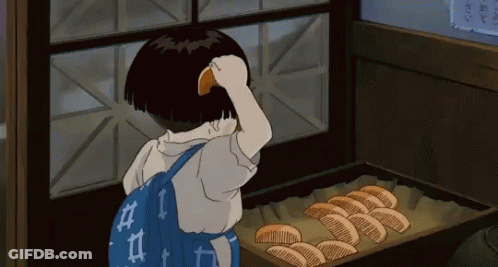 A Little Girl With A Blue Backpack Is Looking At A Tray Of Bread GIF