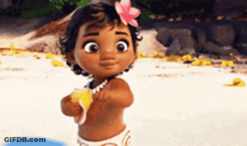 A Little Girl With A Flower In Her Hair Is Standing On The Beach . GIF