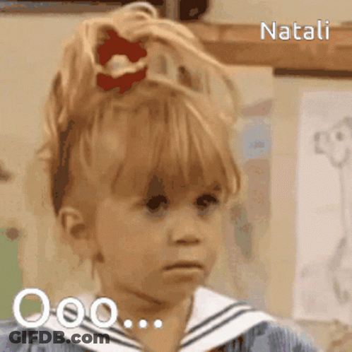 A Little Girl With A Red Bow In Her Hair Is Named Natali GIF