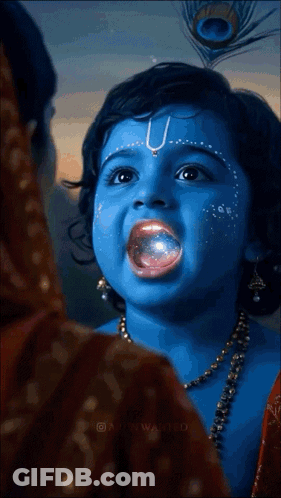 A Little Girl With Blue Paint On Her Face And A Peacock Feather In Her Hair GIF