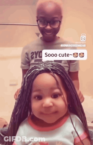 A Little Girl With Braids Has A Sticker That Says Sooo Cute On Her Head GIF