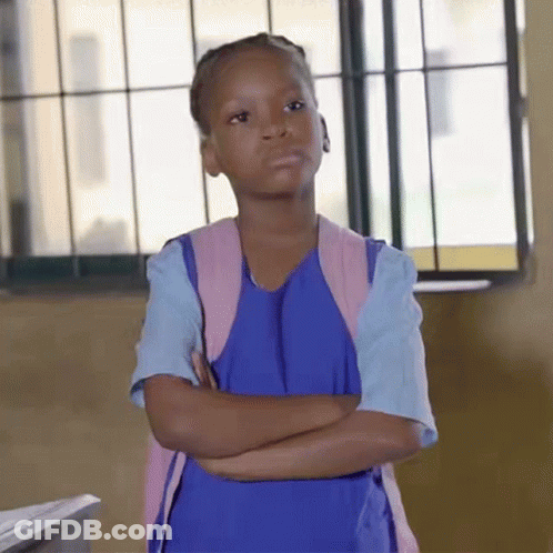 A Little Girl With Her Arms Crossed Wearing A Blue Dress And A Pink Backpack GIF