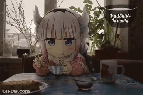 A Little Girl With Horns Is Sitting At A Table Drinking From A Cup GIF