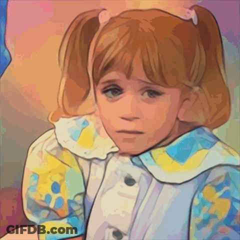 A Little Girl With Pigtails Is Wearing A Blue And Yellow Shirt GIF
