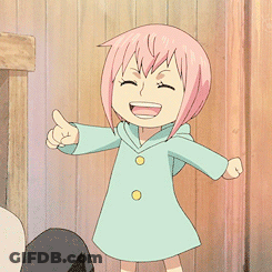 A Little Girl With Pink Hair Is Giving A Thumbs Up Sign GIF