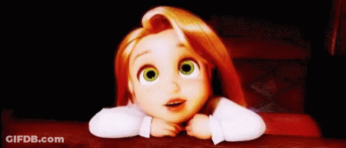 A Little Girl With Red Hair And Green Eyes Is Sitting At A Table With Her Head On Her Hands . GIF
