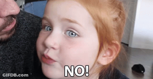 A Little Girl With Red Hair Is Making A Face And Says No GIF