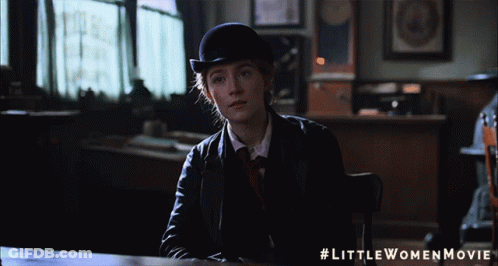 A Little Women Movie Poster With A Woman In A Suit GIF