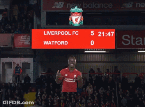 A Liverpool Fc Player Giving A Thumbs Up In Front Of A Scoreboard That Says Watford GIF