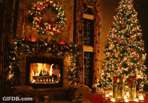 A Living Room Decorated For Christmas With A Fireplace And Christmas Trees GIF