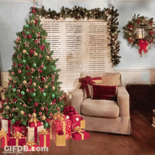 A Living Room With A Christmas Tree And Presents Underneath It GIF