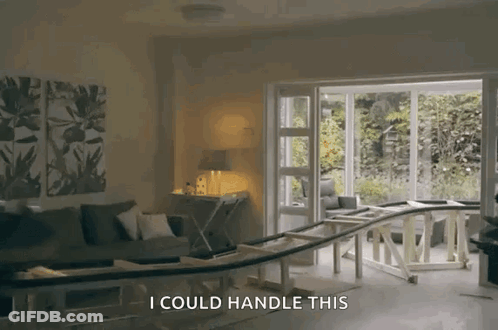 A Living Room With A Couch And A Table And The Words " I Could Handle This " GIF