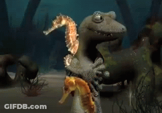 A Lizard Is Holding A Seahorse And Another Seahorse GIF