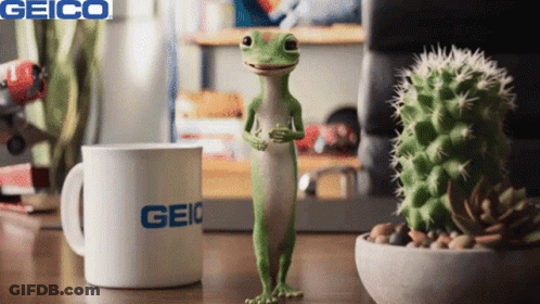 A Lizard Standing Next To A Geico Mug GIF