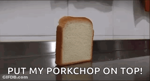 A Loaf Of Bread Is Sitting On A Counter With The Words `` Put My Pork Chop On Top '' . GIF
