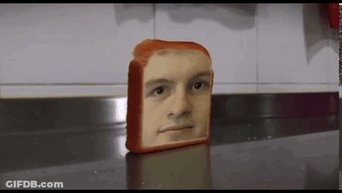 A Loaf Of Bread With A Face On It GIF