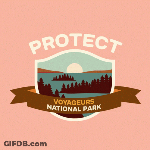A Logo For Voyageurs National Park With A Shield And Ribbon GIF