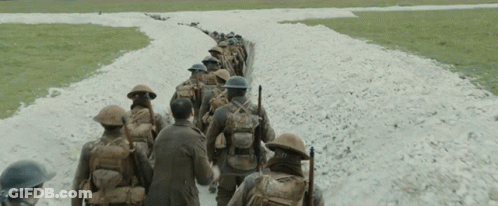 Soldiers Walking Down Dirt Road GIF