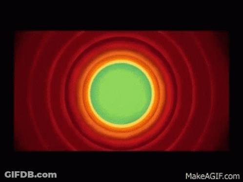 A Looney Tunes Logo With A Green Circle In The Middle Of It GIF