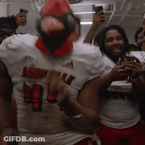 A Louisville Football Player Wearing A Red Cardinal Mask GIF