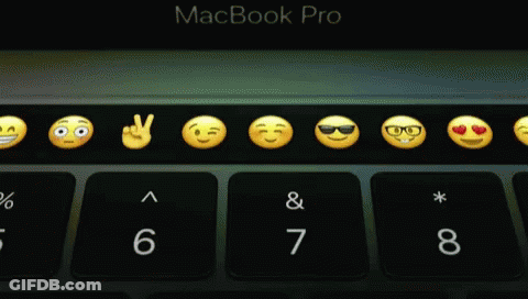 A Macbook Pro Keyboard With Smiley Faces And Numbers GIF