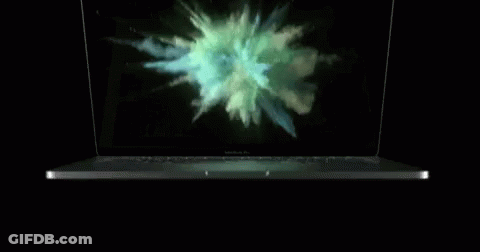 A Macbook Pro Laptop With Smoke Coming Out Of It GIF