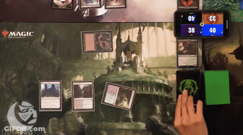 A Magic The Gathering Game Is Being Played On A Ultra Pro Mat GIF