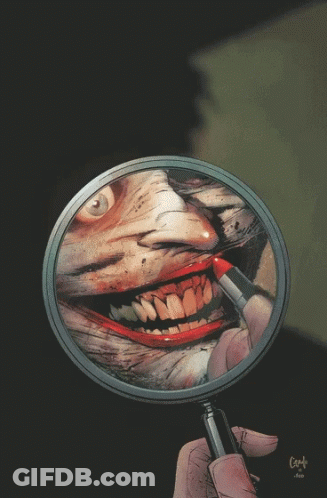 A Magnifying Glass With A Reflection Of A Joker On It GIF