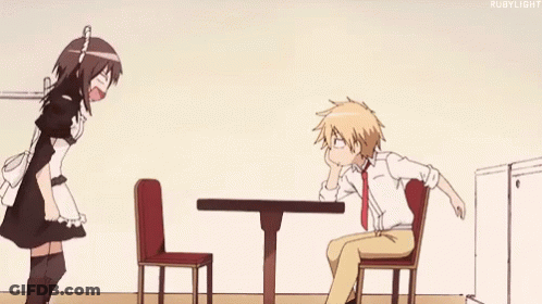A Maid Is Standing Next To A Man Sitting At A Table In A Restaurant . GIF