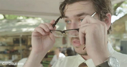 A Man Adjusts His Glasses While Wearing A Wrist Watch GIF