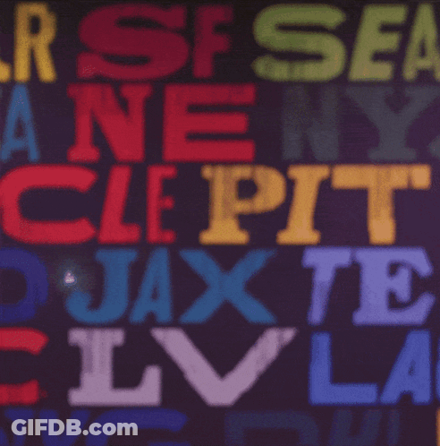 A Man Adjusts His Green Bay Packers Hat In Front Of A Colorful Background GIF