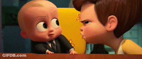 A Man And A Baby Are Standing Next To Each Other On A Table . The Baby Is Wearing A Suit And Tie . GIF