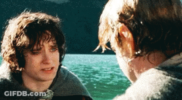 A Man And A Boy Are Looking At Each Other In Front Of A Lake GIF