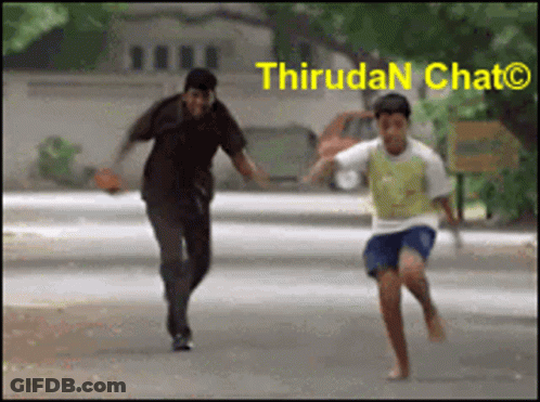 A Man And A Boy Are Running Down A Street With The Words Thirudan Chat On The Bottom Right GIF