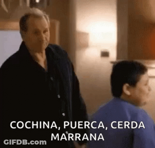 A Man And A Boy Are Standing Next To Each Other In A Kitchen And The Man Is Talking To The Boy . GIF