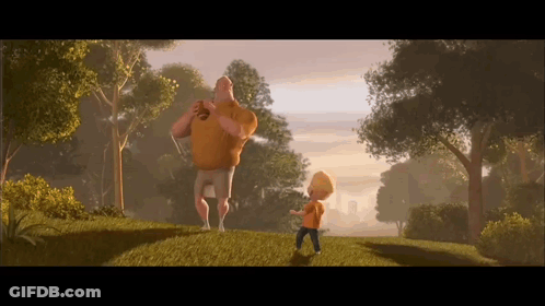 A Man And A Boy Are Standing On A Grassy Hillside GIF