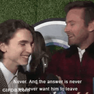 A Man And A Boy Are Talking To Each Other On A Red Carpet And The Answer Is Never We Never Want Him To Leave . GIF