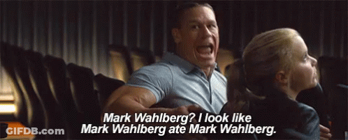 A Man And A Girl Are Sitting In A Movie Theater And The Girl Is Asking The Man If He Looks Like Mark Wahlberg . GIF