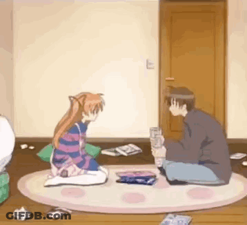 A Man And A Girl Are Sitting On The Floor In A Room Playing A Game . GIF