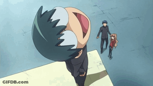 A Man And A Girl Are Standing Next To A Cartoon Character With A Big Mouth GIF