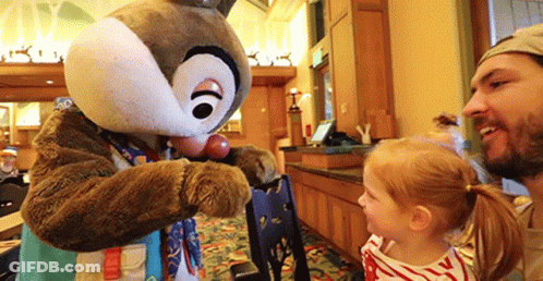 A Man And A Little Girl Are Standing Next To A Chipmunk Mascot . GIF