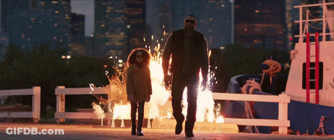 A Man And A Little Girl Are Walking In Front Of A Boat On Fire GIF