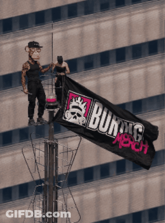 A Man And A Monkey Holding A Burning Merch Flag On Top Of A Building GIF