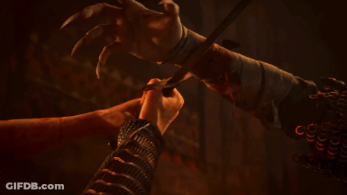 A Man And A Monster Are Looking At Each Other In The Dark GIF
