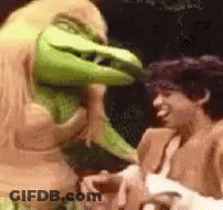 A Man And A Monster Are Standing Next To Each Other . GIF