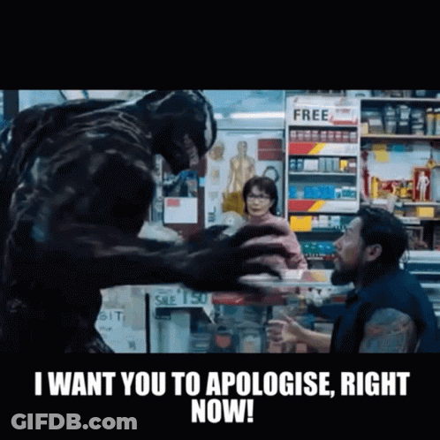 Man And Monster In Store With Apologize Sign GIF
