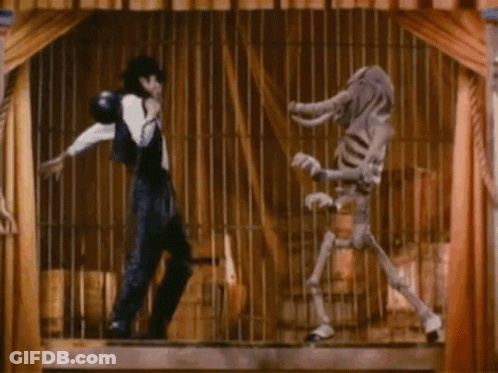 A Man And A Skeleton Are In A Cage And The Skeleton Is Wearing An Elephant Costume GIF