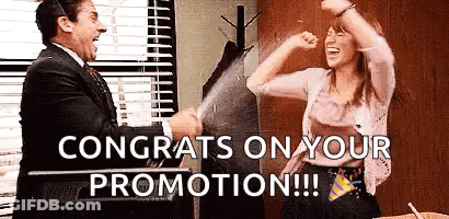 A Man And A Woman Are Celebrating A Promotion In An Office . GIF