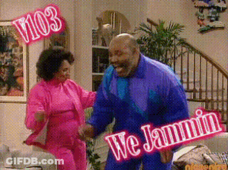 A Man And A Woman Are Dancing In A Living Room With A Sign That Says We Jammin .. GIF